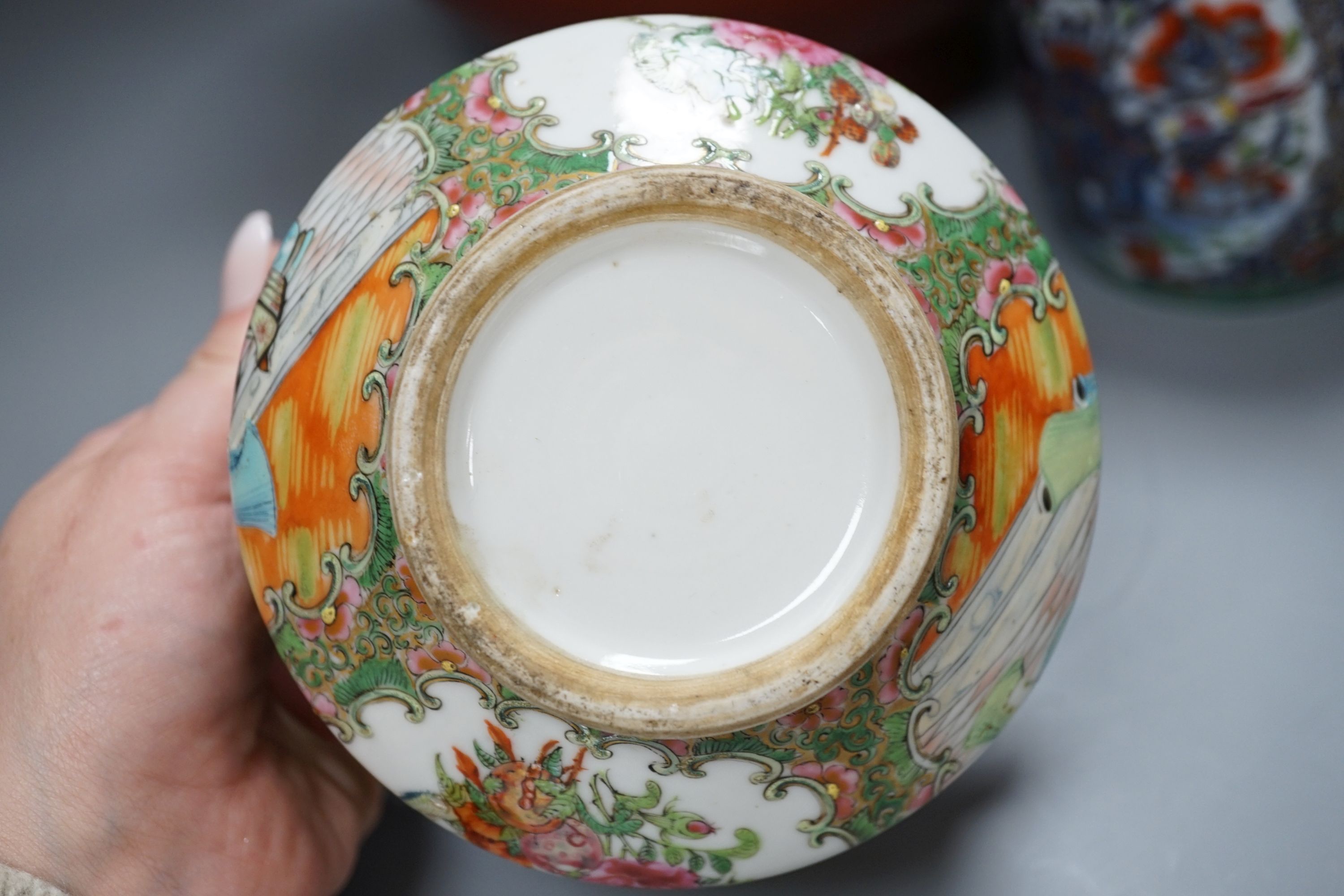 A 19th century Chinese famille rose pot and cover, 15cm diam., together with a decorative Chinese jug and large monochrome china pot